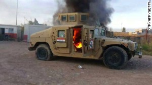 140612082458-iraq-mosul-burning-humvee-story-body.jpg