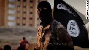 141117103601-isis-masked-militant-flag-story-body.jpg