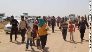 140611080728-06-iraqi-civilians-flee-mosul-story-body.jpg