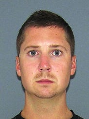 635737815183985448-072915uc-officer-mugshot.jpg