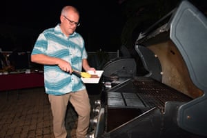 Scott Morrison tends to the barbecue at the home of the Australian high commissioner to the Solomon Islands on Sunday. Scott Morrison tends to the barbecue at the home of the Australian high commissioner to the Solomon Islands on Sunday.